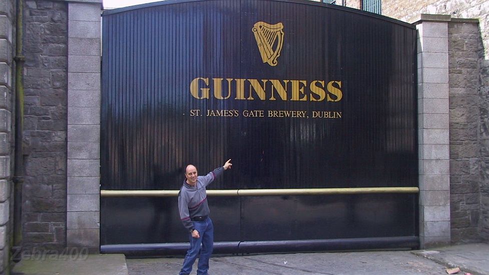 09-Laurie checks out the back entrance to the Guiness factory.JPG